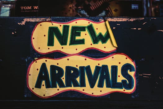 A vibrant handmade 'New Arrivals' sign with bold colors, displayed in a Los Angeles store.