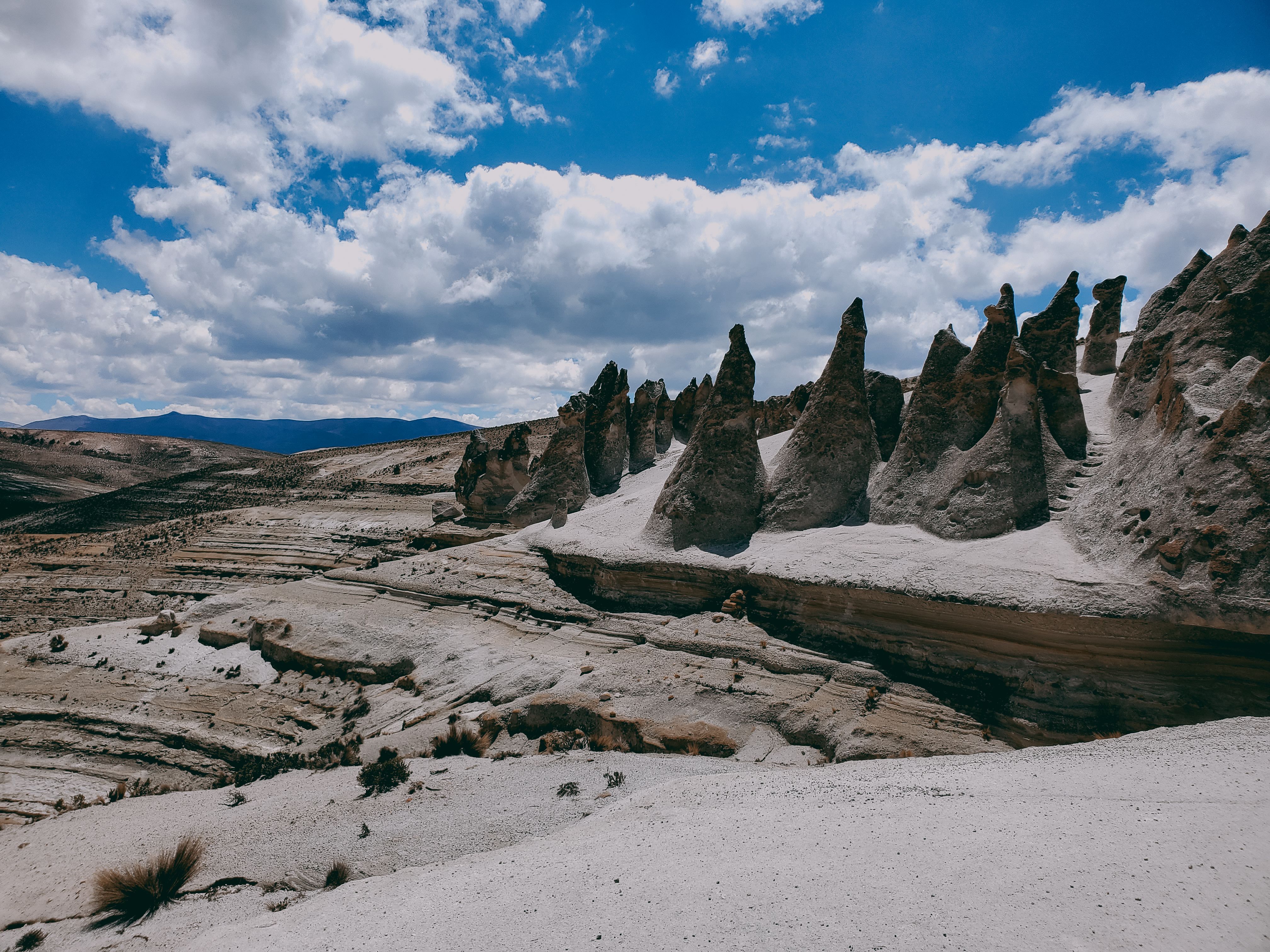 Majestic Rock Formations Under Blue Sky · Free Stock Photo