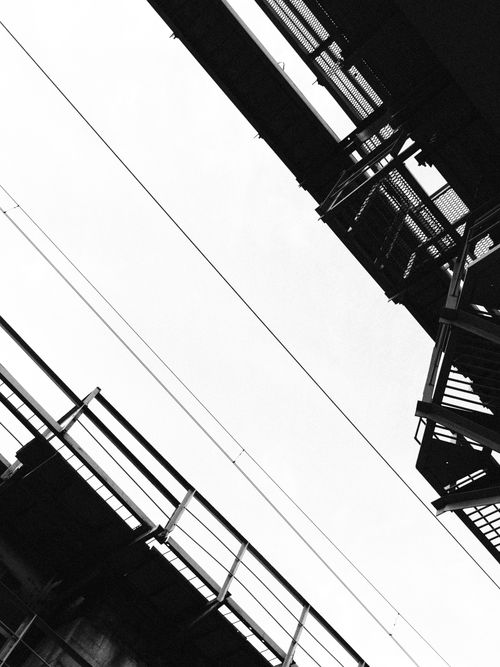 Free Artistic angle of industrial architecture with geometric patterns in monochrome. Stock Photo
