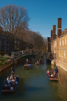 Scenic view of punting boats under the Mathematical Bridge in Cambridge, England.