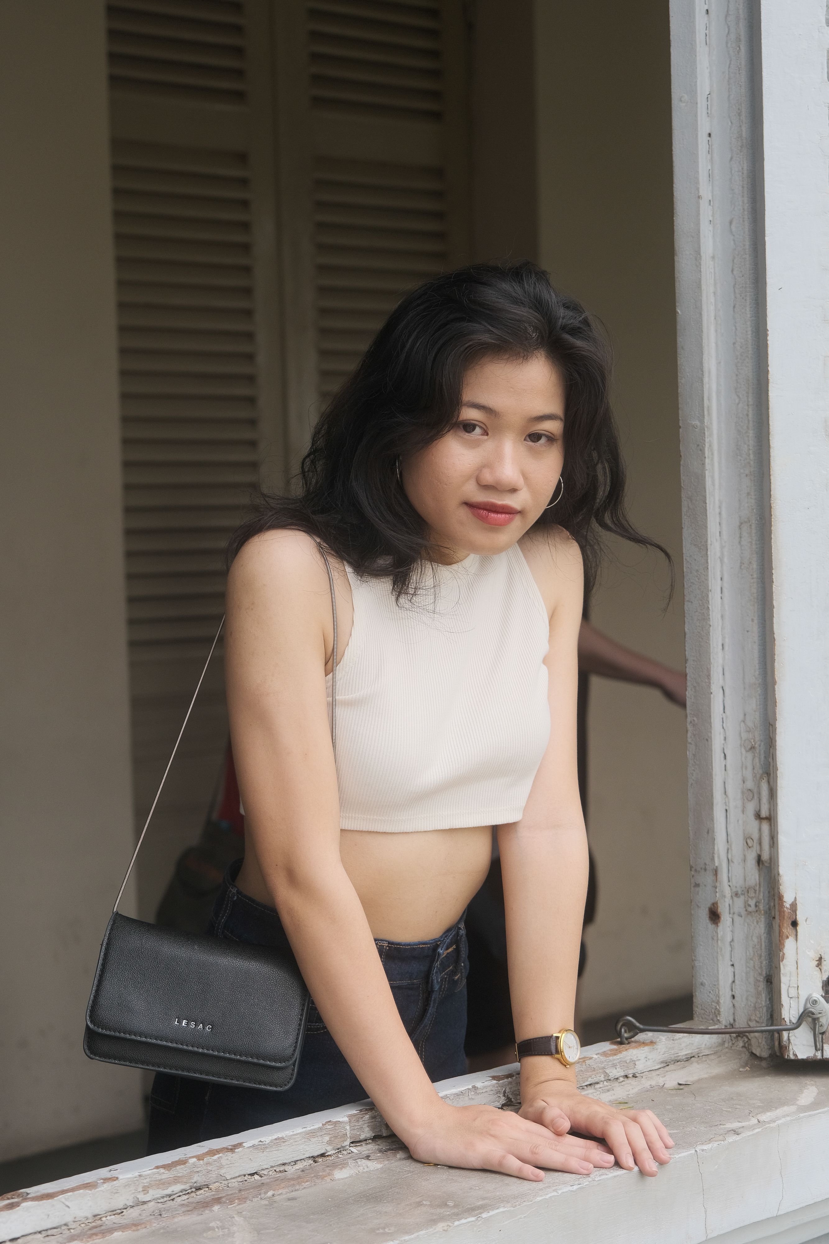 Stylish Young Woman by Window in Ho Chi Minh
