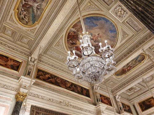 Stunning Chnadelier under Baroque Inspired Ceiling