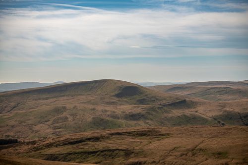 Free Stunning landscape view of rolling hills in Wales under a blue sky, perfect for outdoor enthusiasts. Stock Photo