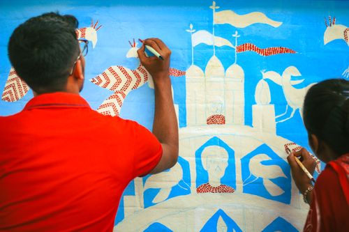 Free Two artists painting a vibrant mural in Dhaka, showcasing traditional Bangladeshi art style. Stock Photo