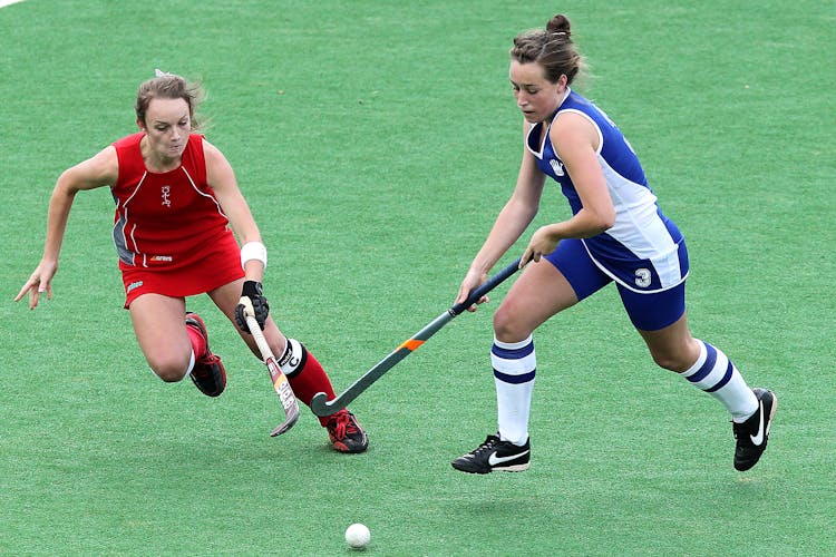 Two Woman Competing For A Goal