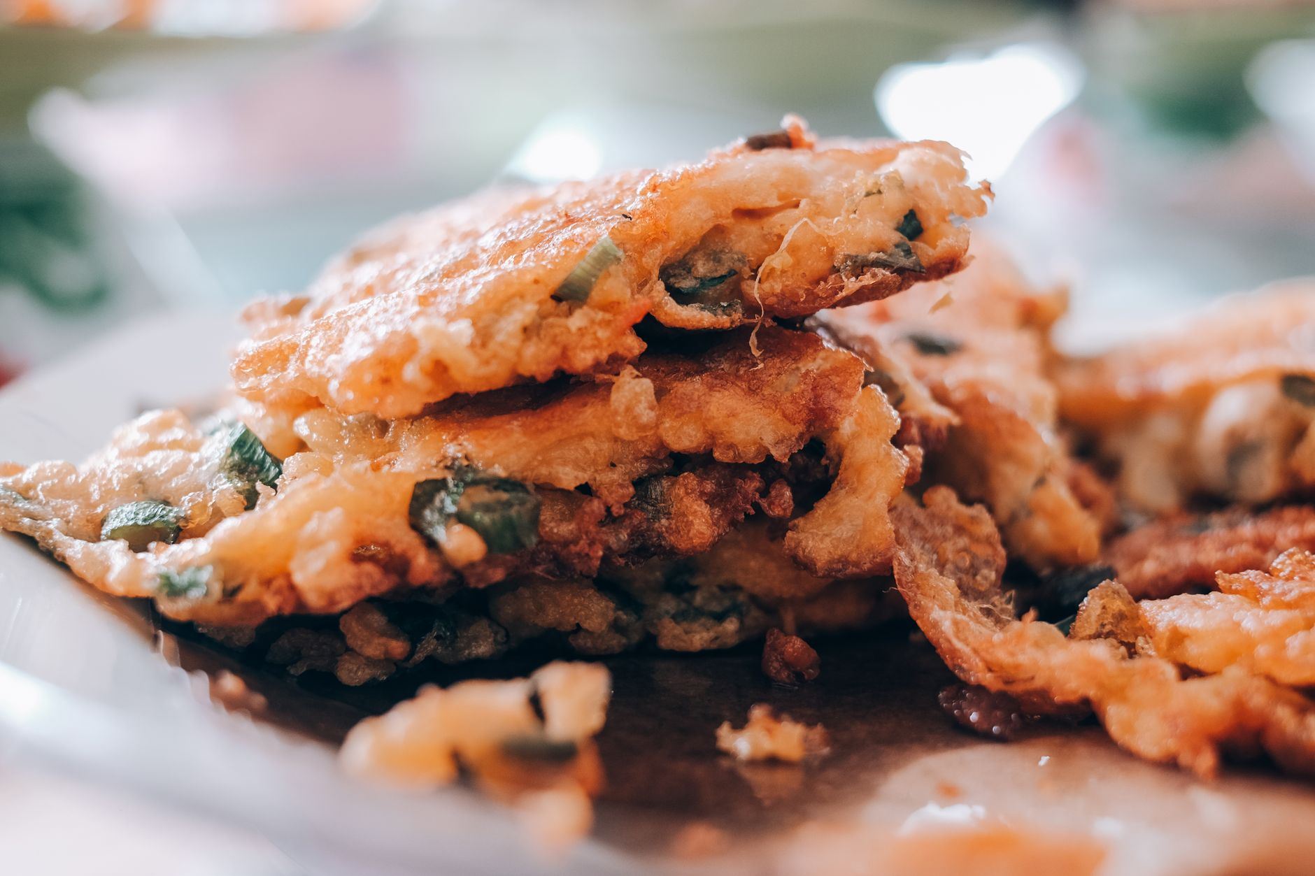 Stack of crispy malanga fritters on a plate