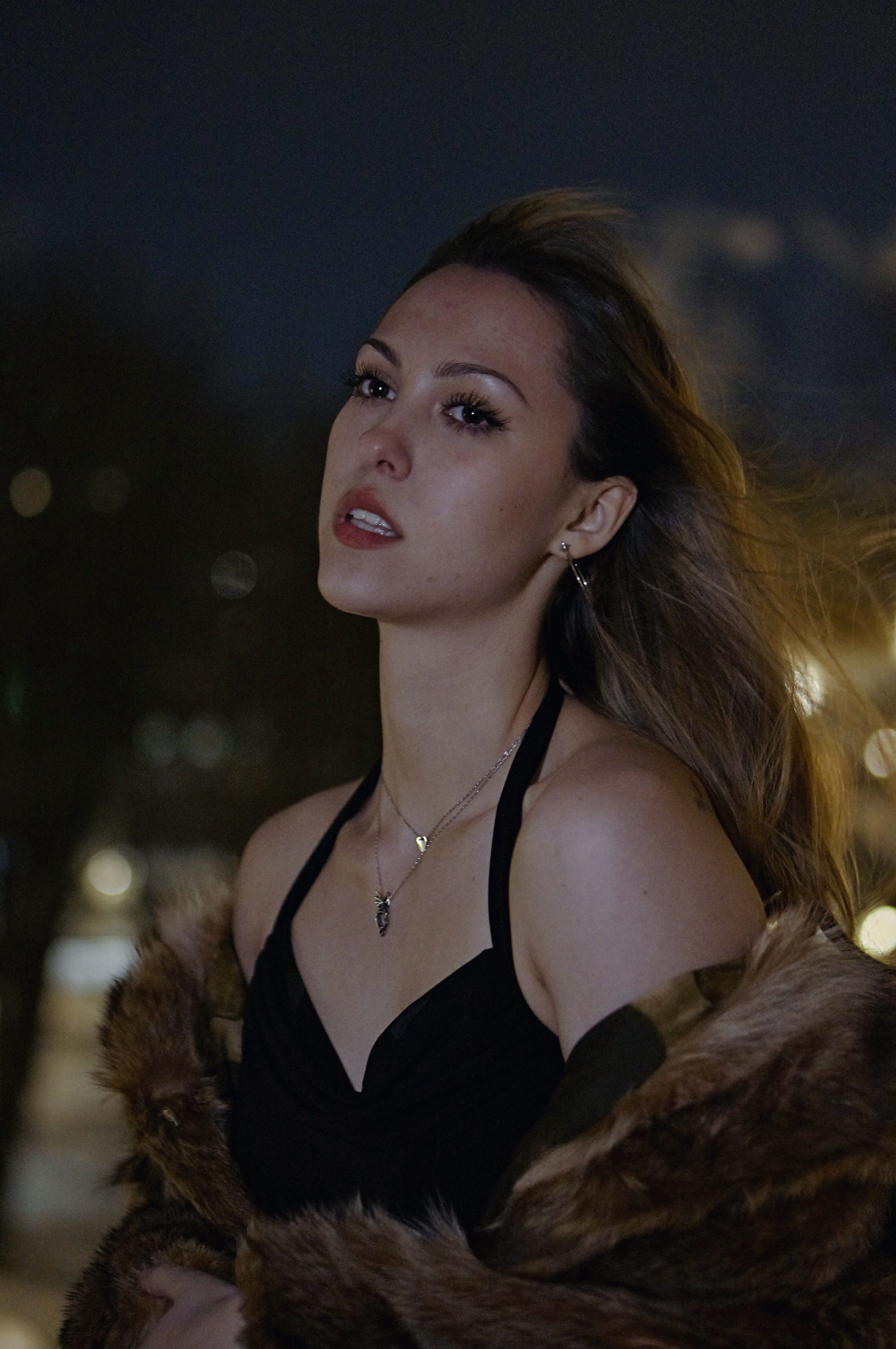 Elegant Woman Posing at Night Outdoors · Free Stock Photo