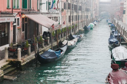 Boats on River near Buildings