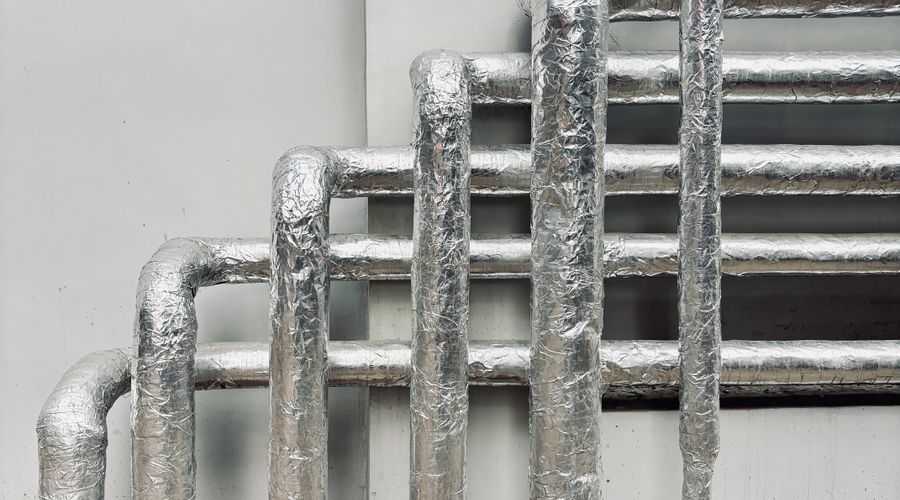 Pipe insulation being applied for winter protection