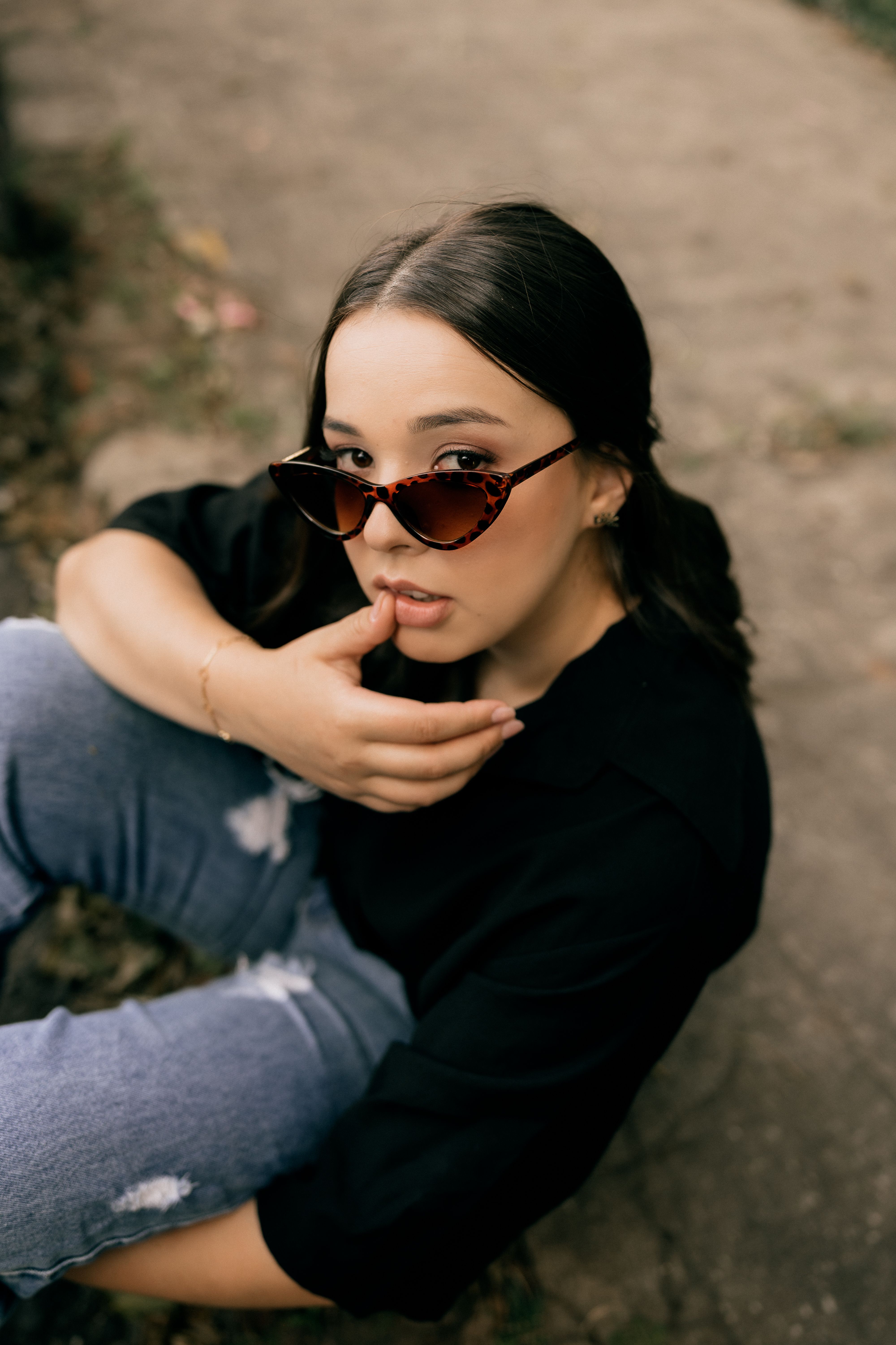 Stylish Woman in Sunglasses Posing Outdoors · Free Stock Photo