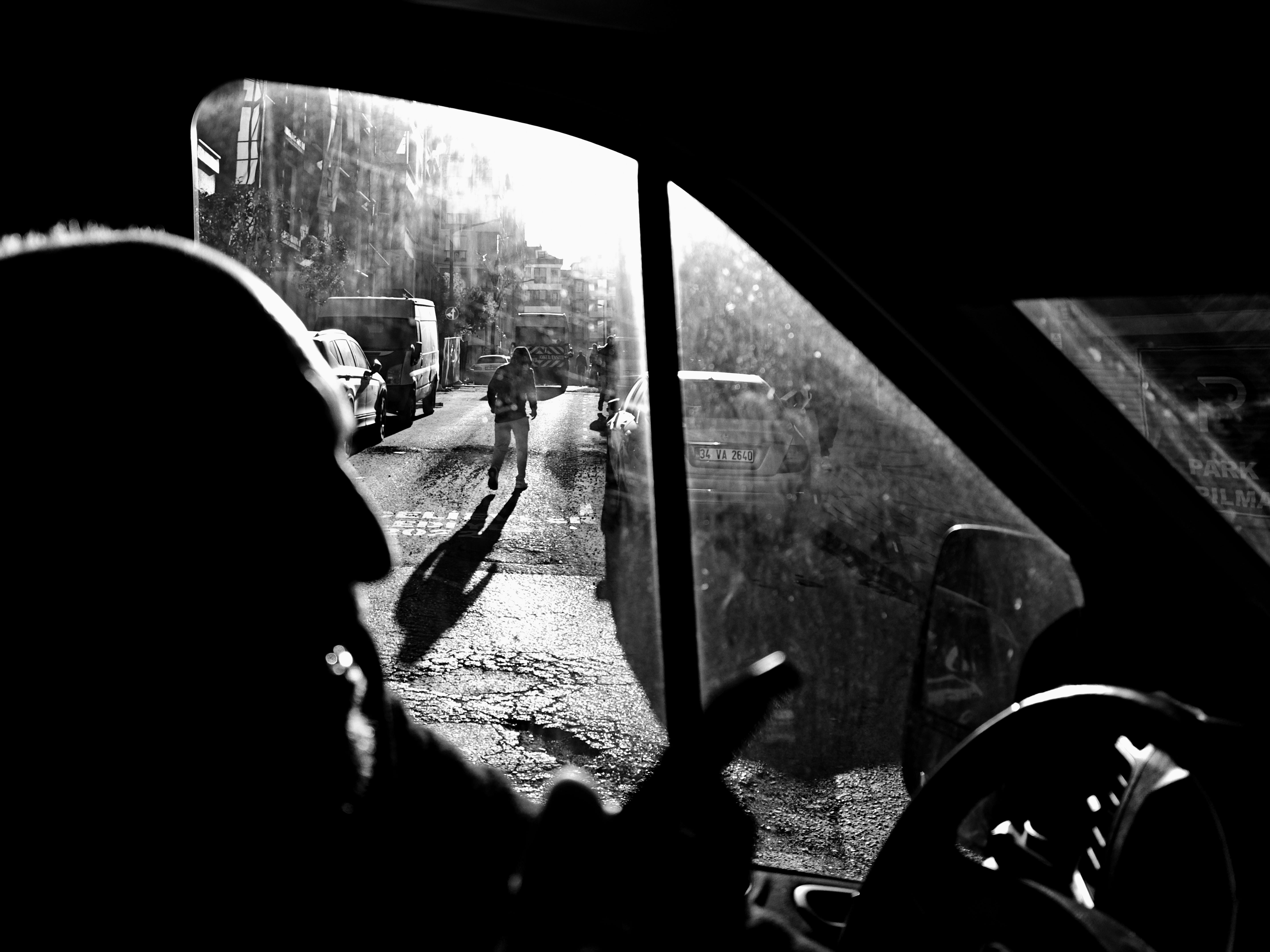 Dramatic street scene with silhouettes and sunlight in İstanbul, Türkiye.