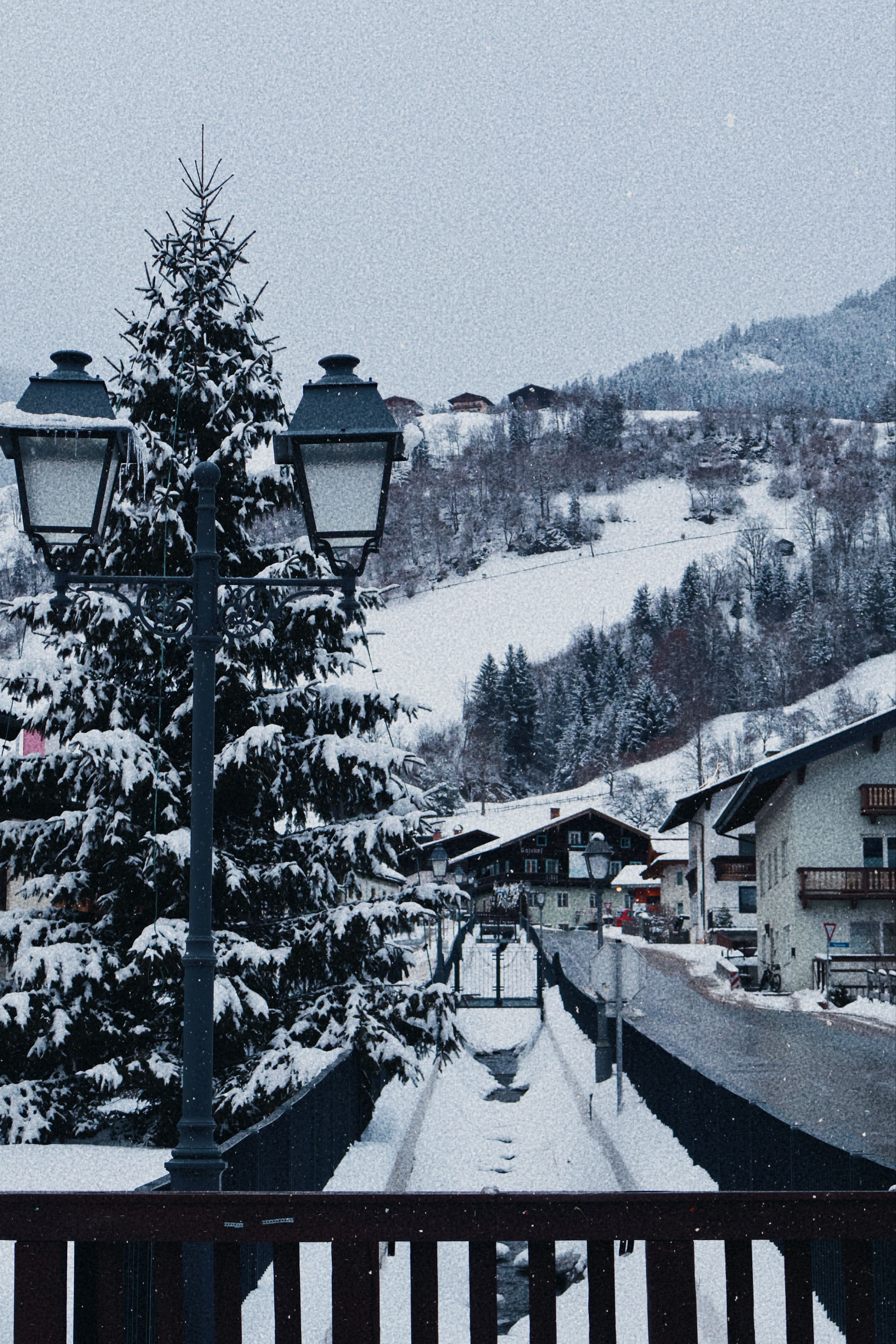 Scenic view of snow-covered houses and street in Mittersill, Salzburg, Austria.
