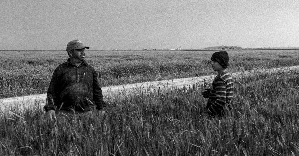 moody 1990s independent film still, two people talking in a diner
