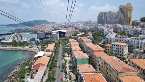 Free Aerial view of Phú Quốc, Vietnam showcasing vibrant architecture, coastline, and modern structures. Stock Photo