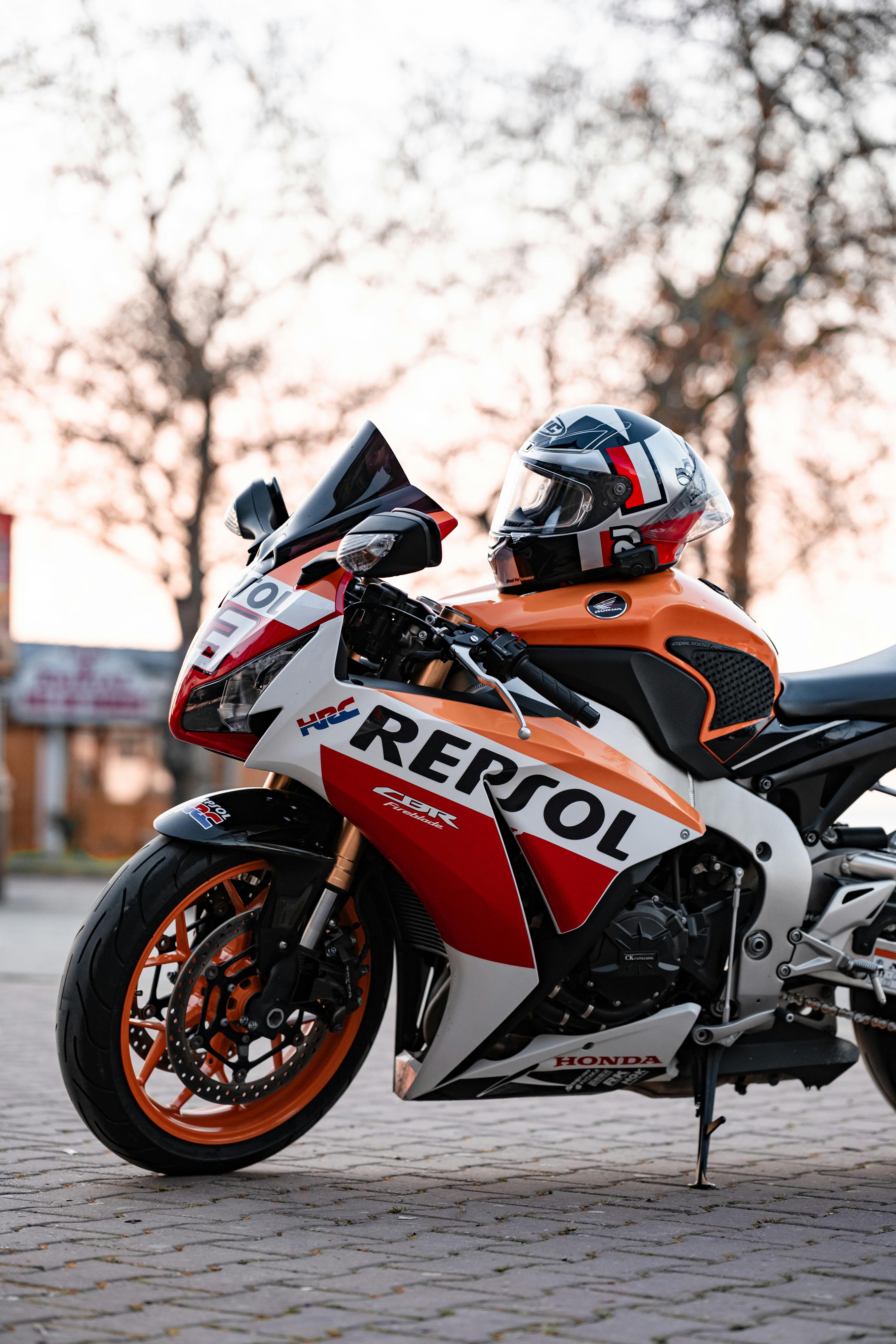 A sleek sports motorcycle with vibrant graphics parked outdoors against a sunset backdrop in Yalova, Türkiye.