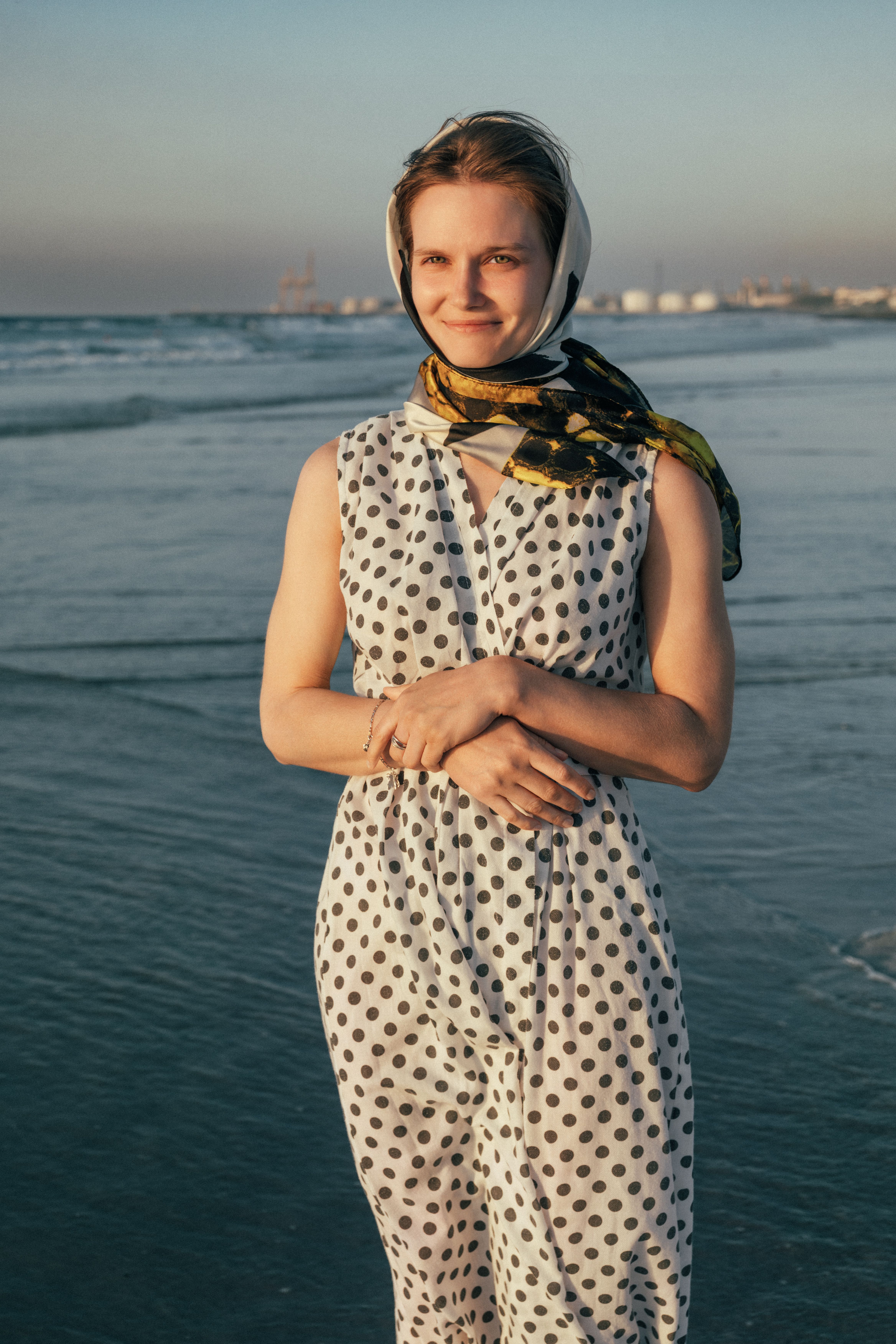 Woman in Polka Dot Dress on Beach at Sunset · Free Stock Photo