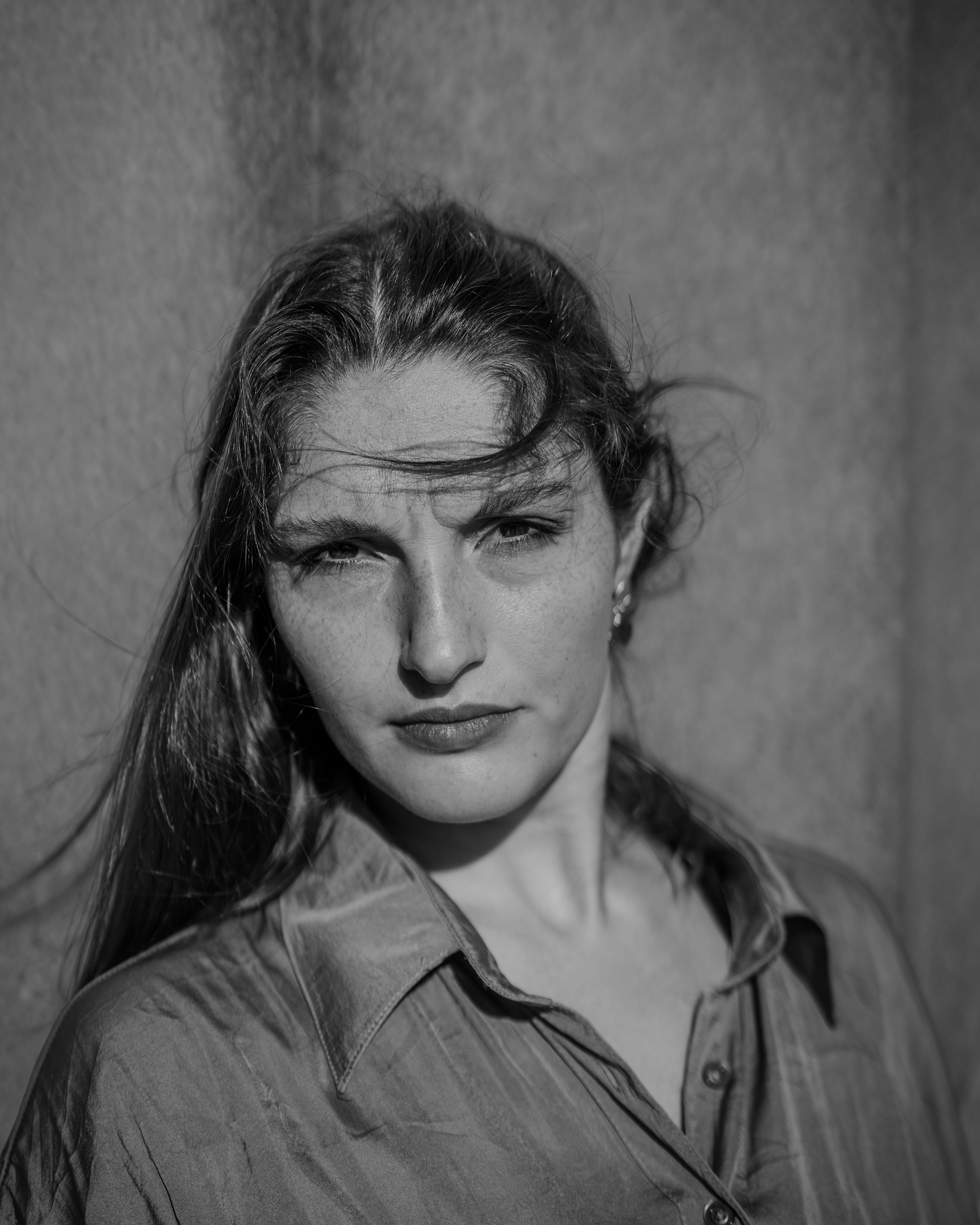Black and White Portrait of a Woman with Windblown Hair · Free Stock Photo