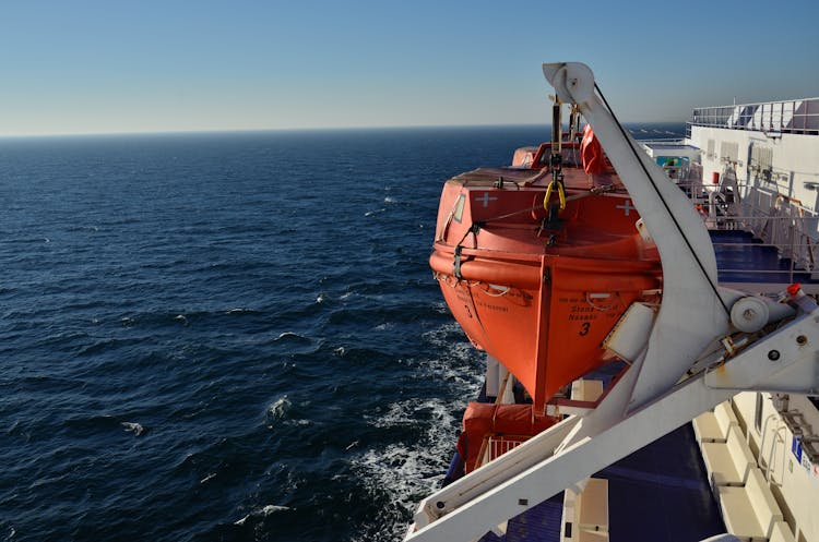 Orange And White Ship On Sea