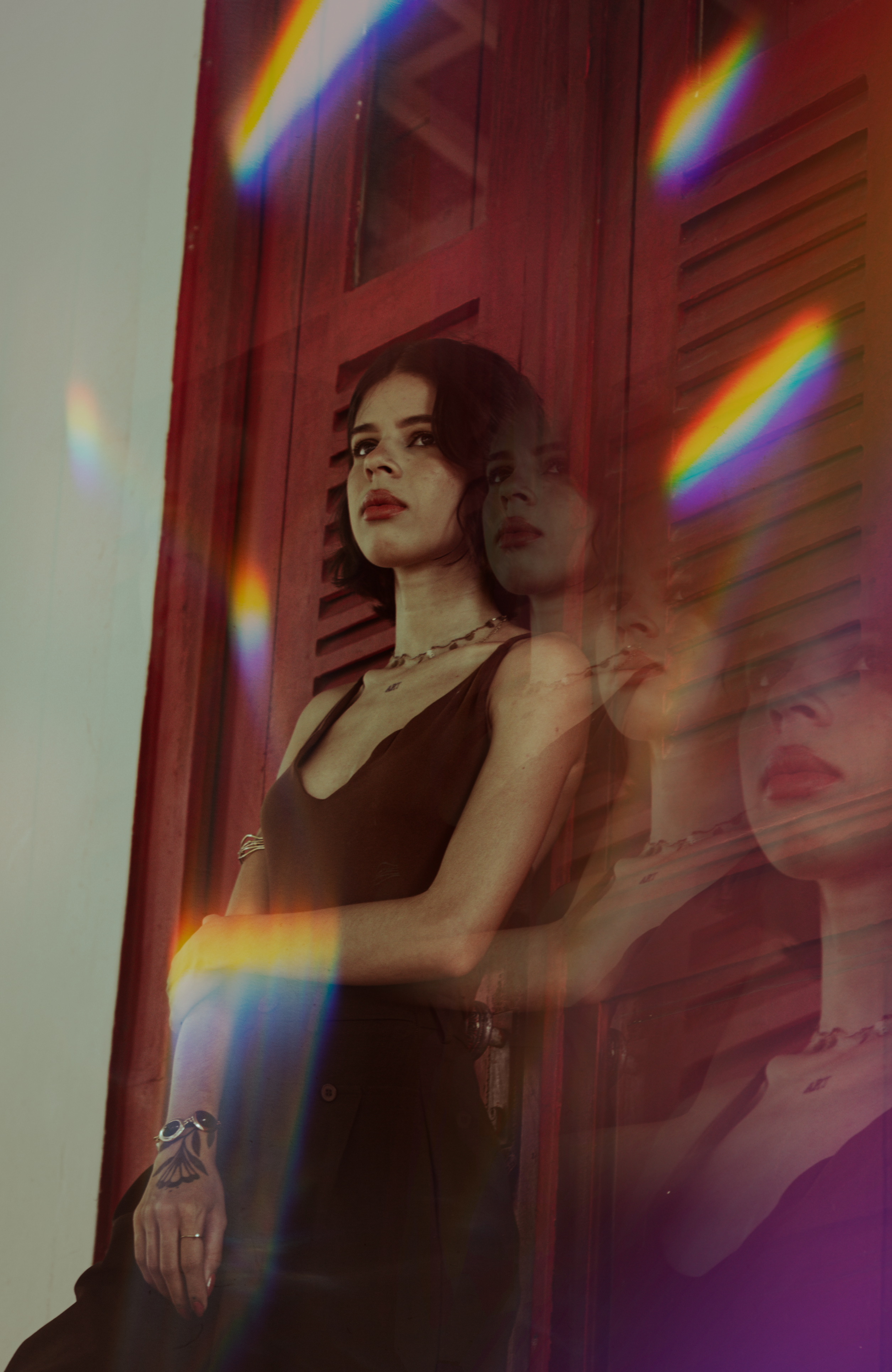 An artistic portrait with a prism light effect.