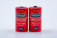 Close-up of two vintage Eveready Energizer transistor batteries on a white background.