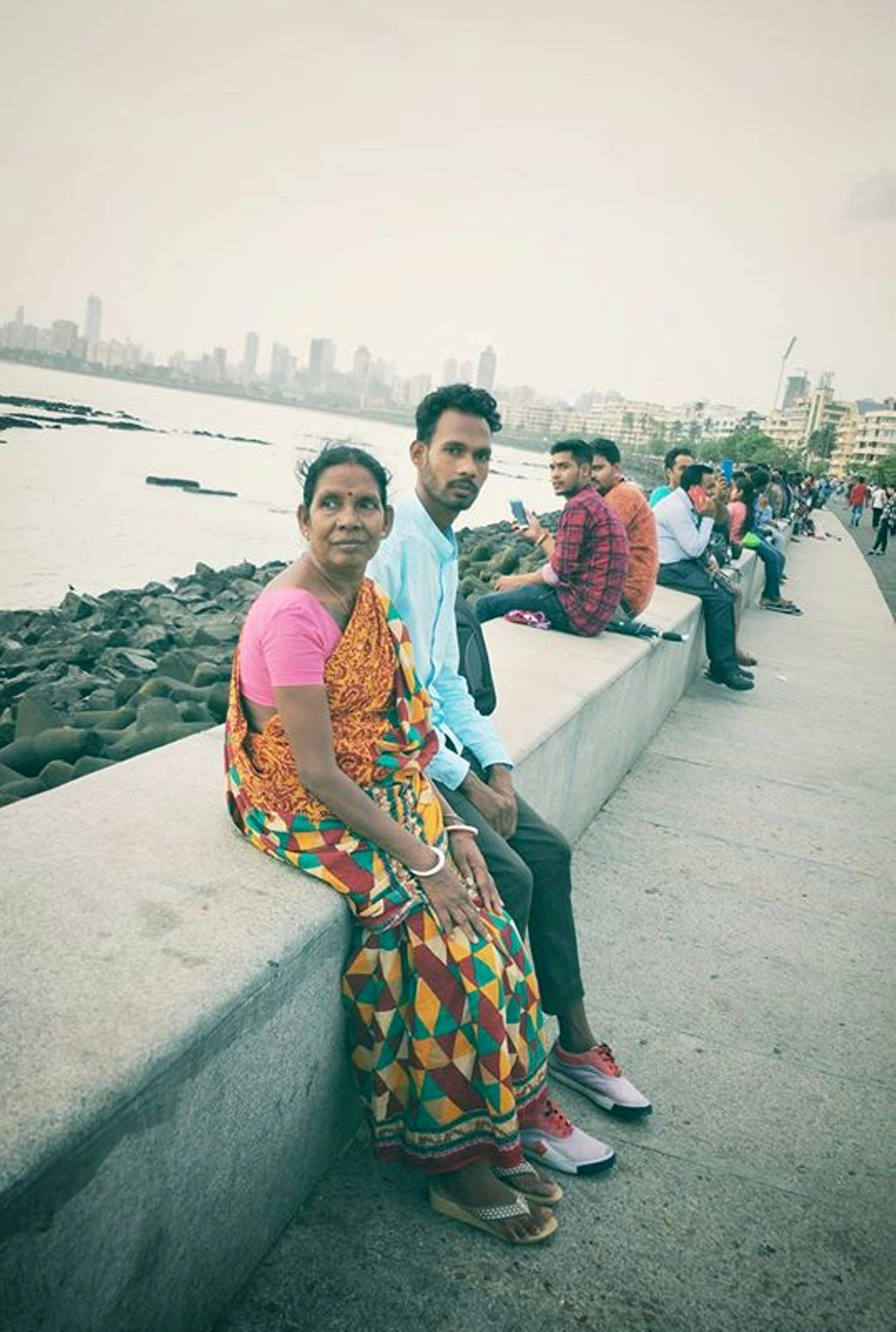 Hiker rappelling in a red rock canyon