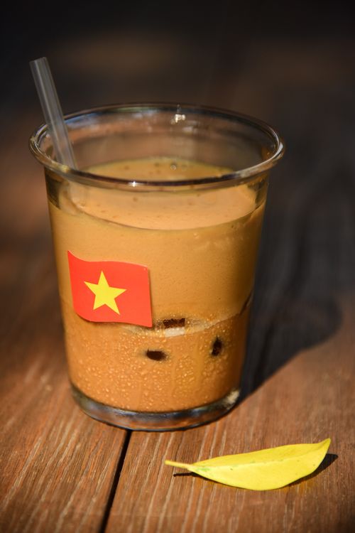 Free A refreshing Vietnamese iced coffee in a glass with a flag label. Stock Photo