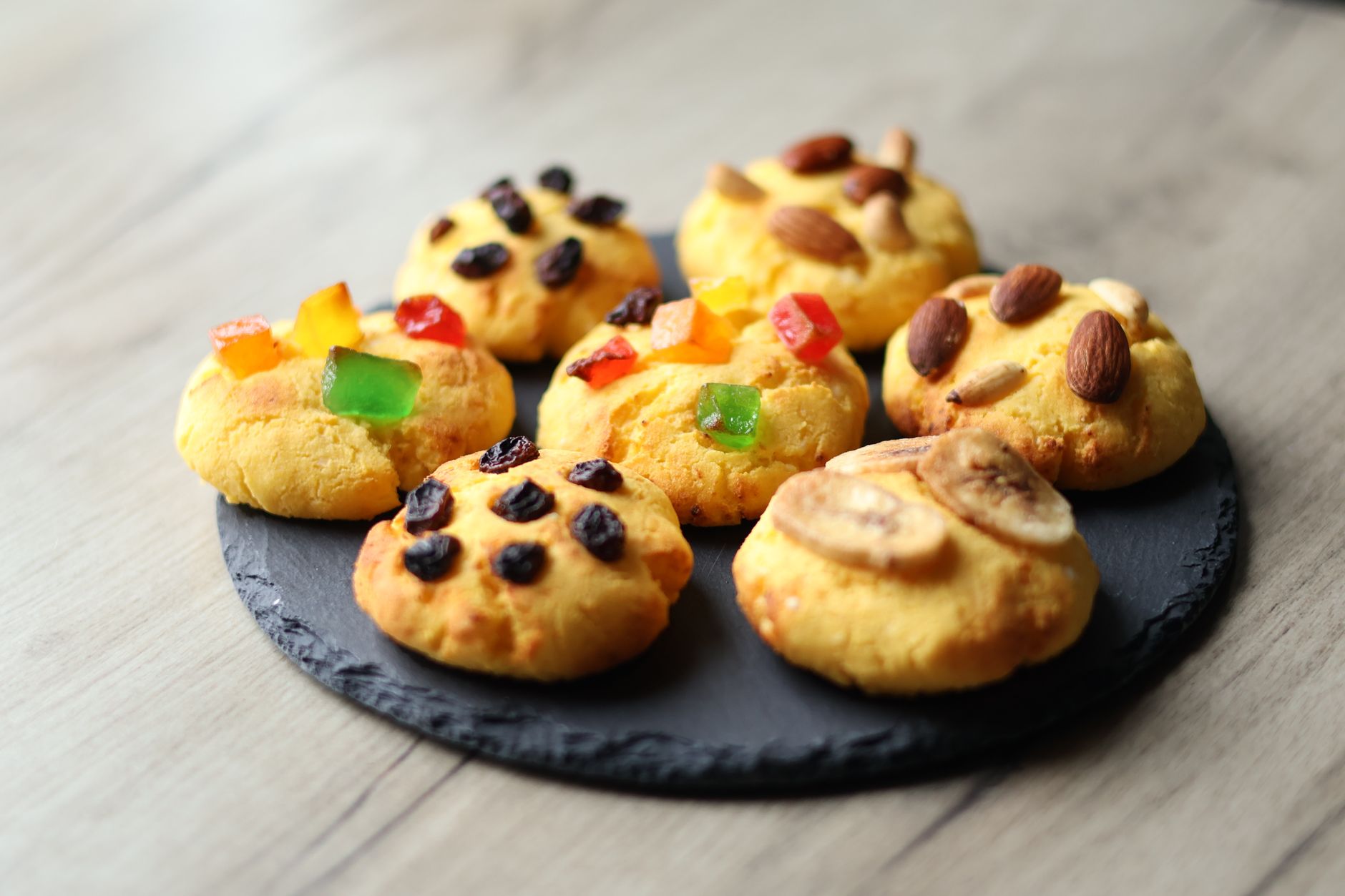 Dried cherry and almond cookies on a wire rack
