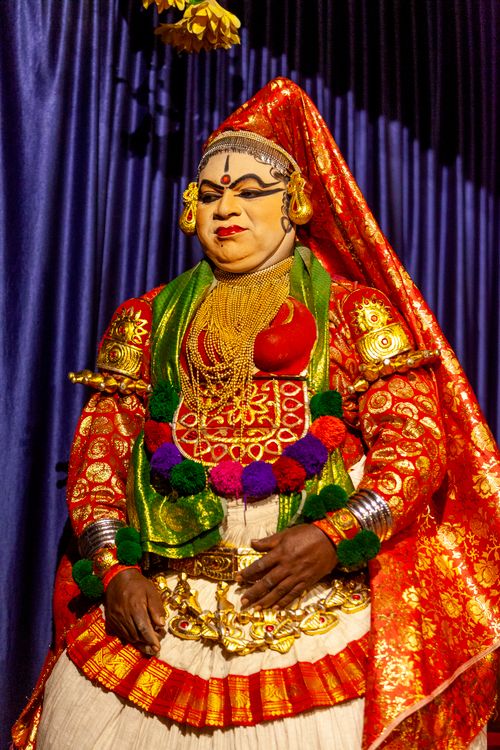 Free A vibrant photo of a traditional Kathakali performer in elaborate costume and makeup. Stock Photo