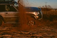 Photo Of a Man Driving 4x4 Off Road Car