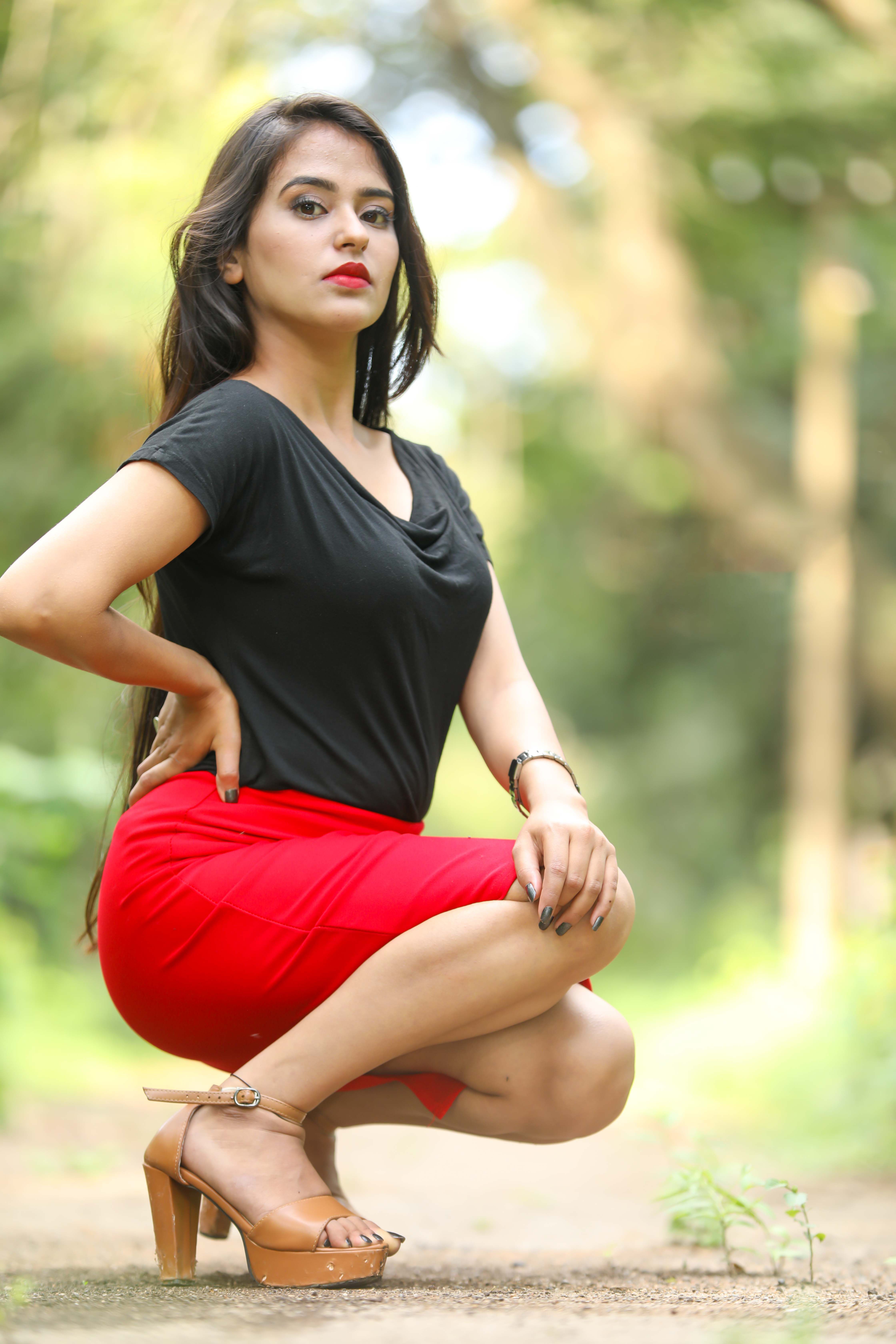 Chic outdoor fashion photoshoot featuring a stylish Indian model in a vibrant setting.