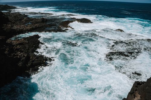 Free Powerful waves crash against the rugged coast of Lanzarote, creating a dramatic seascape. Stock Photo