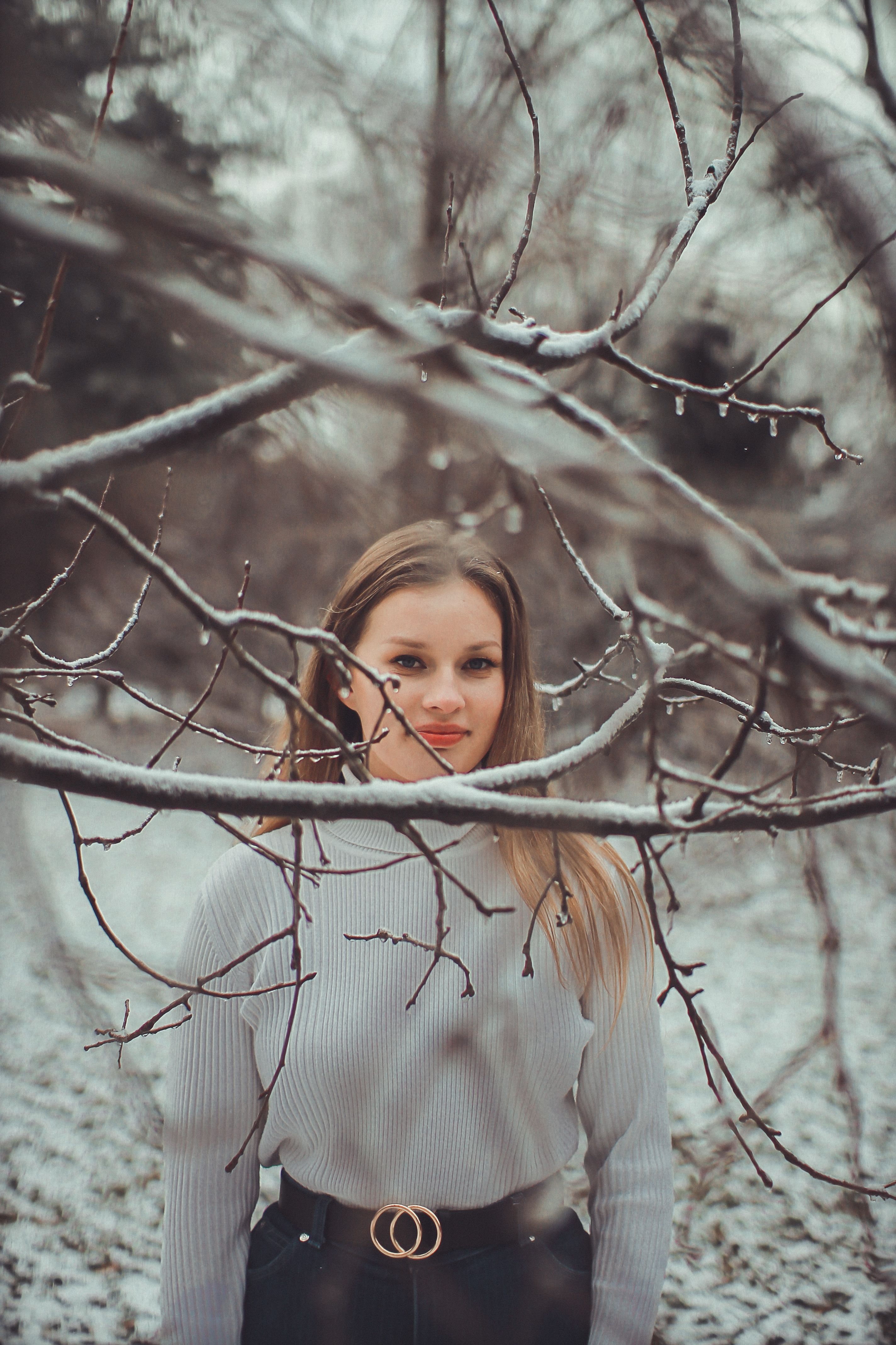 Woman in White Long Sleeve Standing on Tree Branch · Free Stock Photo