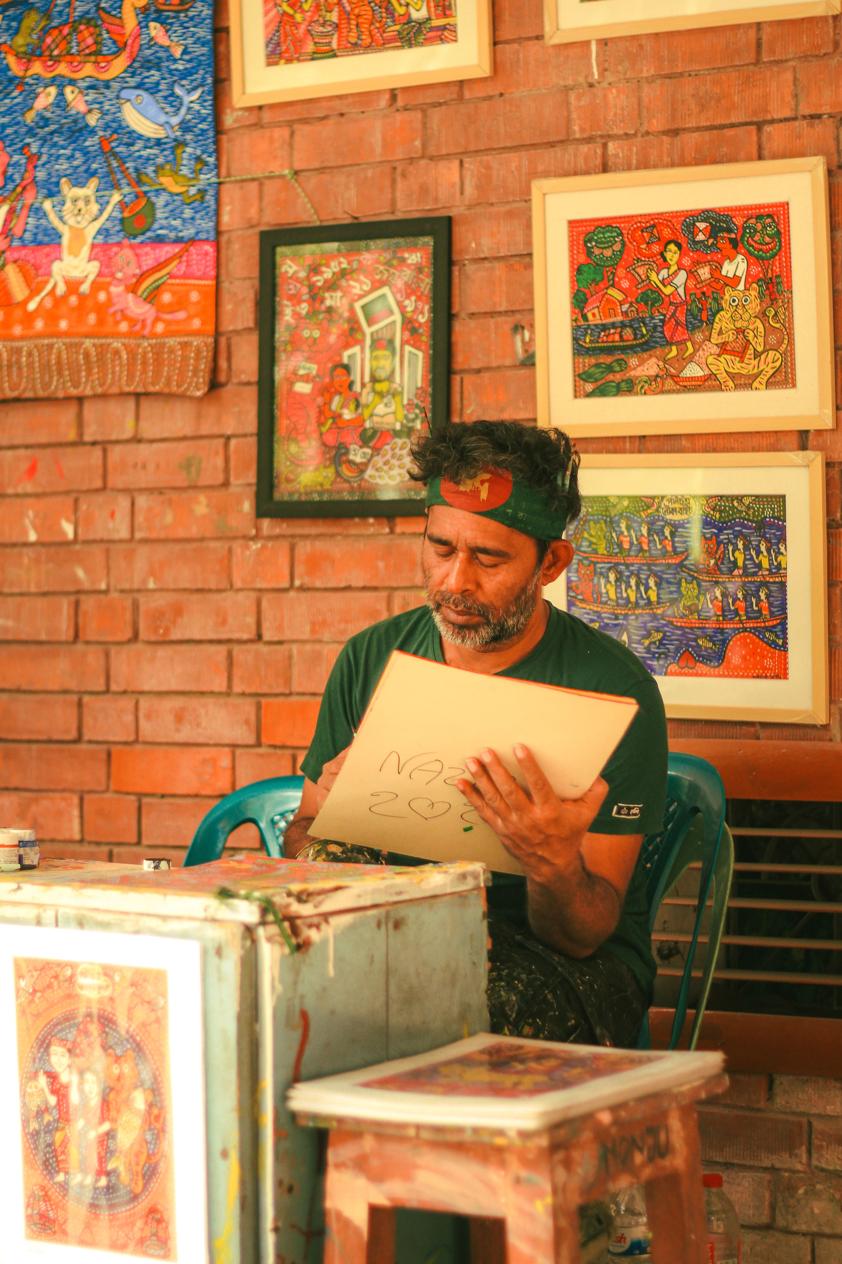 Traditional Painter Creating Art in Dhaka Studio · Free Stock Photo