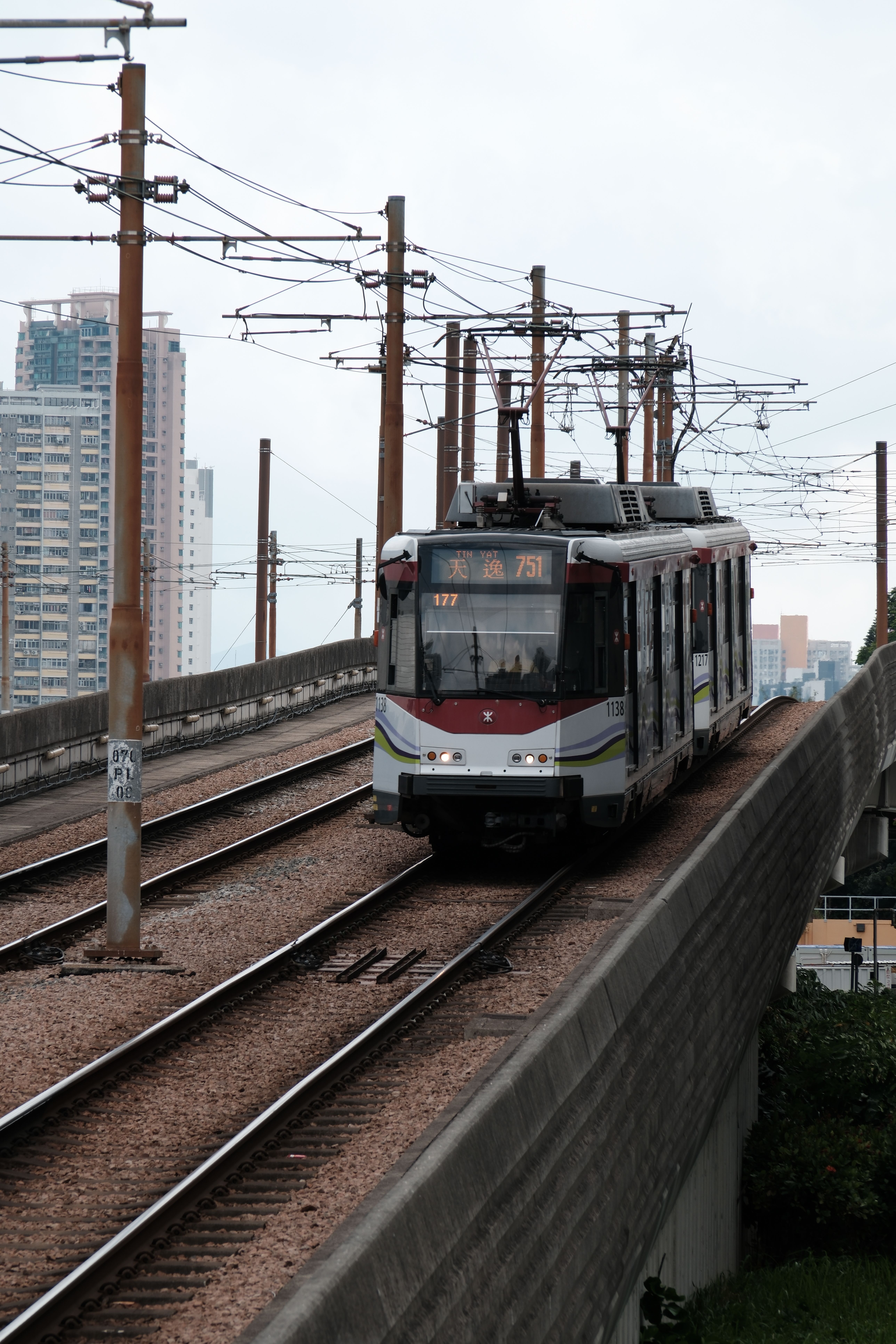 Modern Tram on Elevated Railway in City · Free Stock Photo