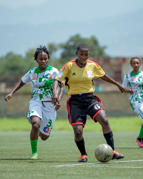 Free Dynamic soccer game with players in action on a sunny day outdoors. Stock Photo