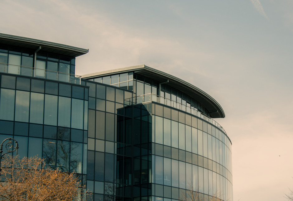 Modern glass office building in Chester representing a UK property company group