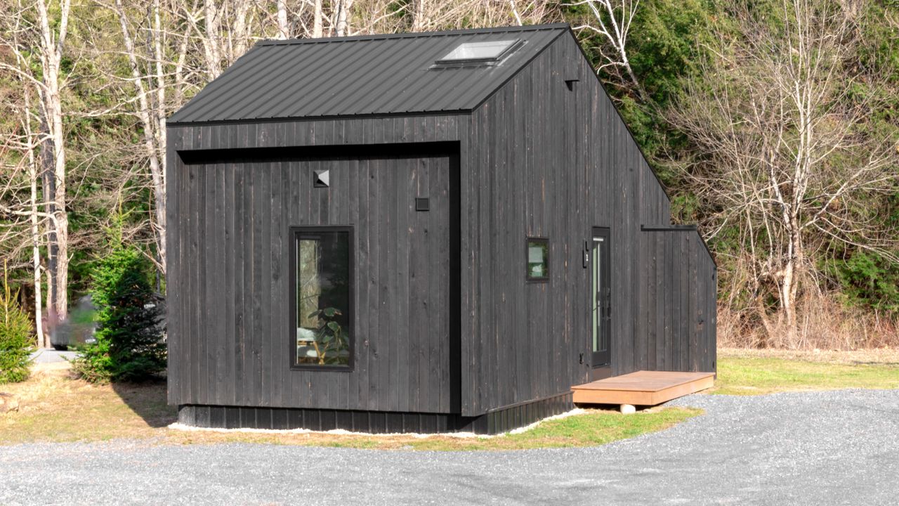 Tiny house in a permanent rural setting Small modern tiny house in a forest setting showing compact permanent living