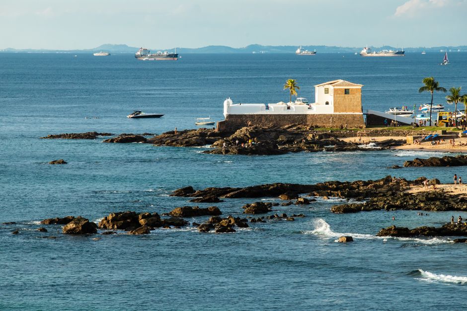 Scenic view of Forte de Santa Maria and rocky coastline in Salvador, Brazil.