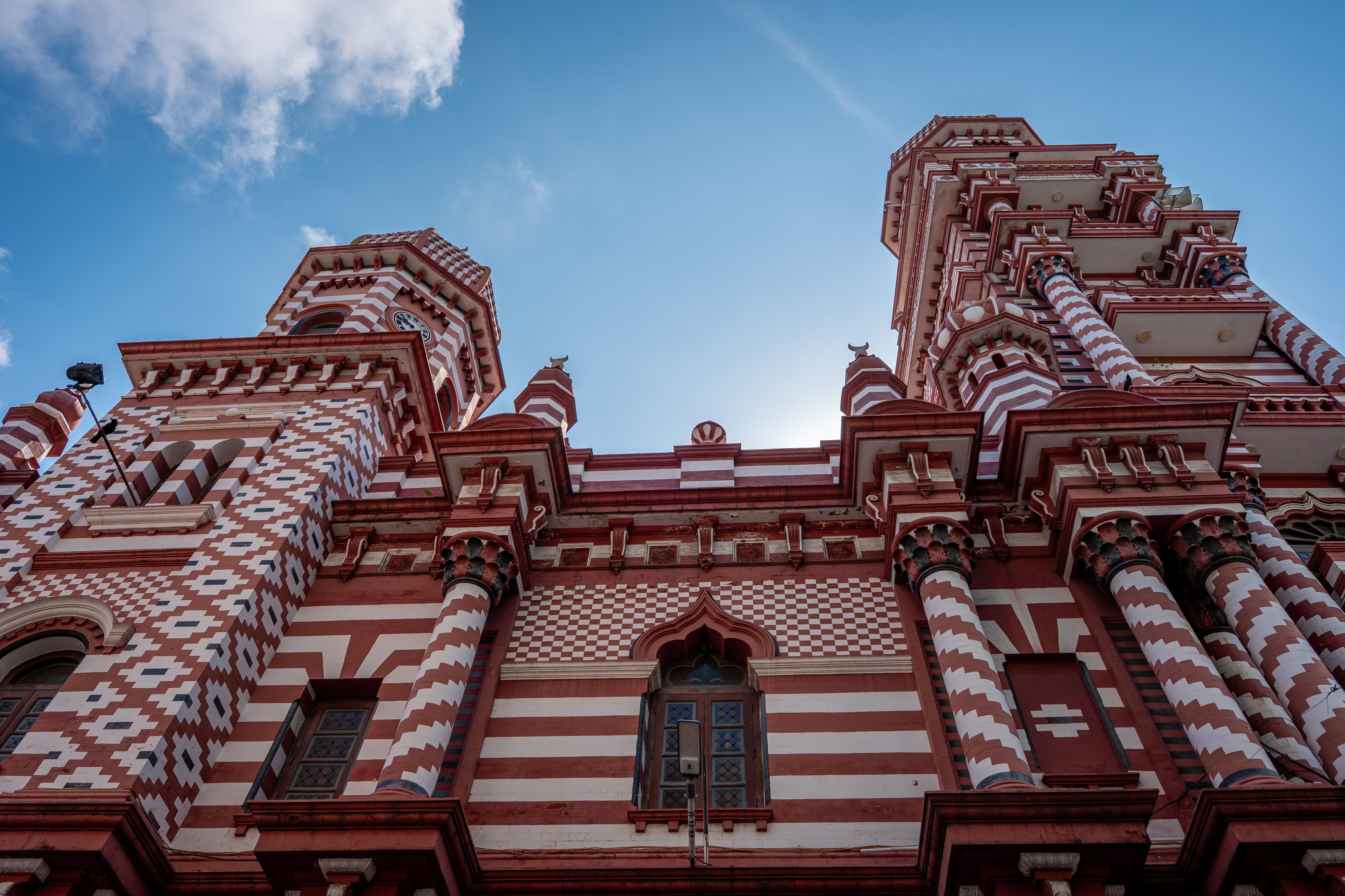 Exploring the unique Islamic architectural style of the Red Mosque in Colombo, Sri Lanka.