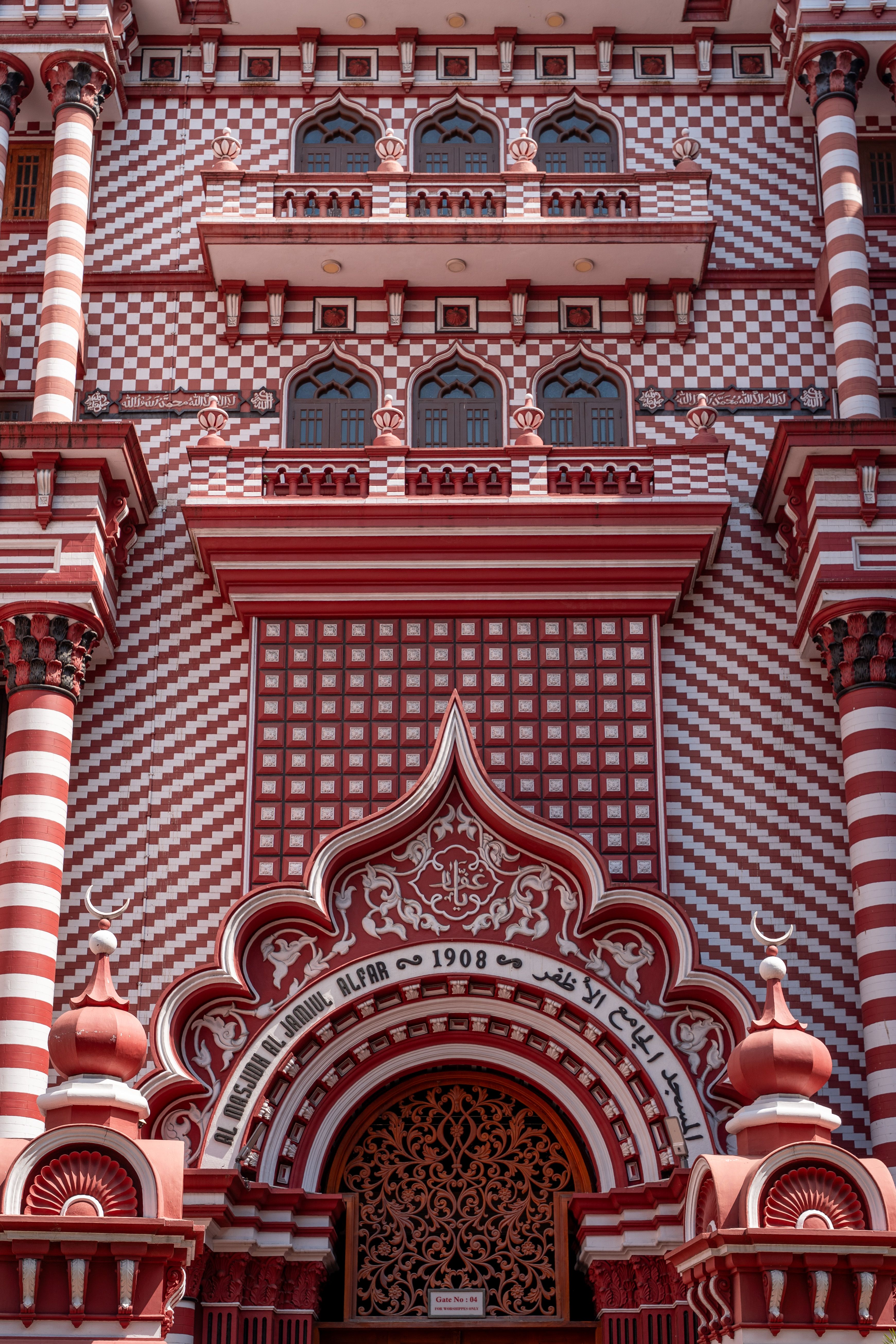 Detailed view of the colorful Jami Ul-Alfar Mosque facade in Colombo.
