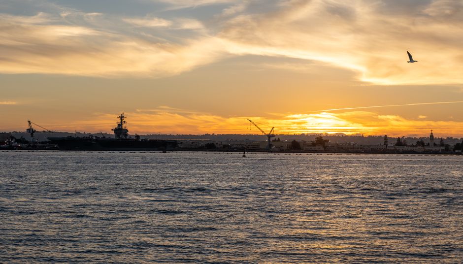 U.S. aircraft carrier strike group moving through the Persian Gulf at sunset U.S. aircraft carrier strike group moving through the Persian Gulf at sunset