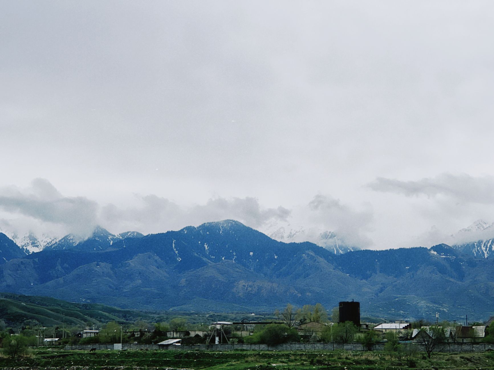 Scenic mountain landscape with overcast skies in Talgar, Almaty Region, Kazakhstan.
