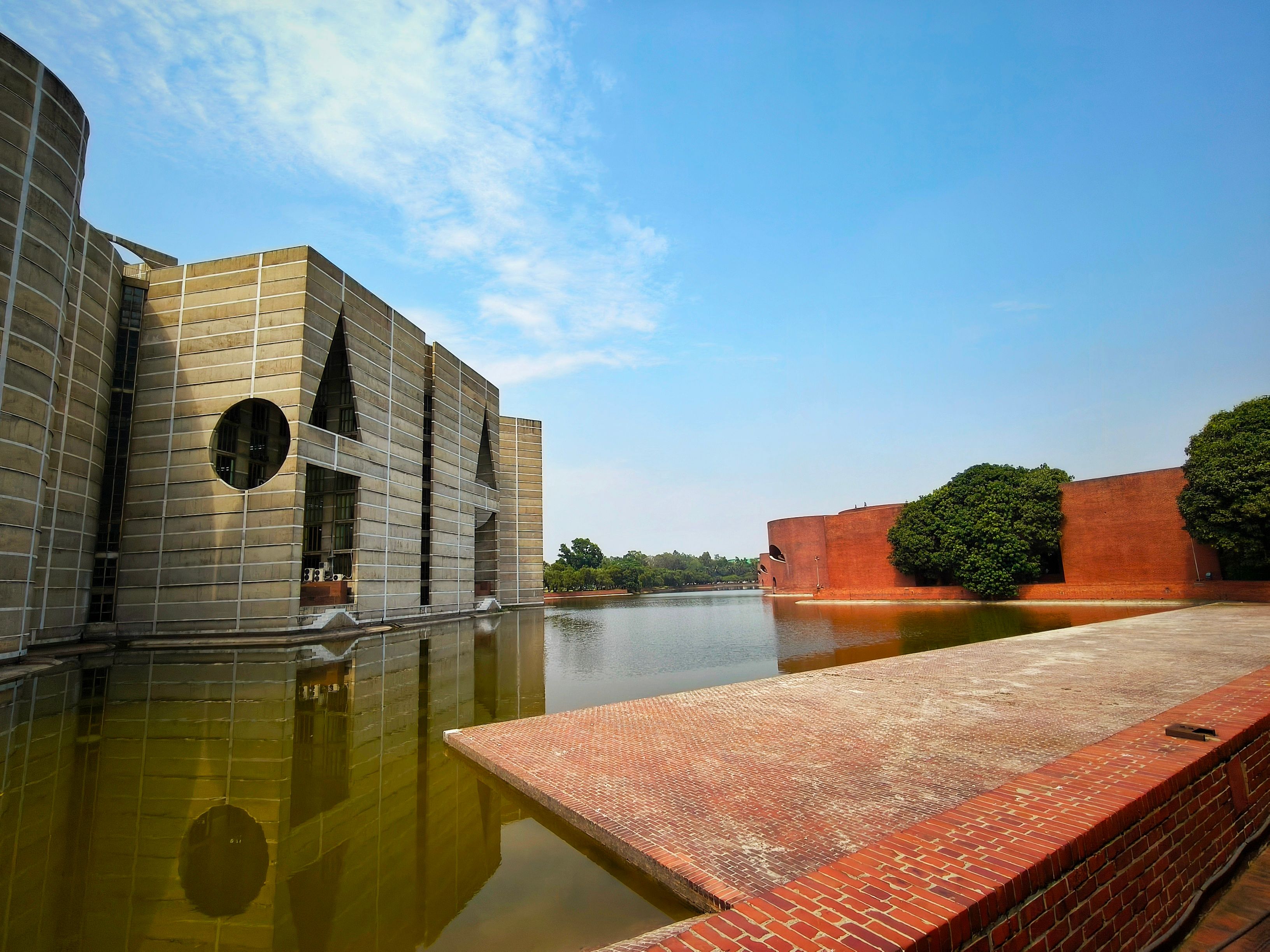 Modern Architectural Landmark by Water · Free Stock Photo