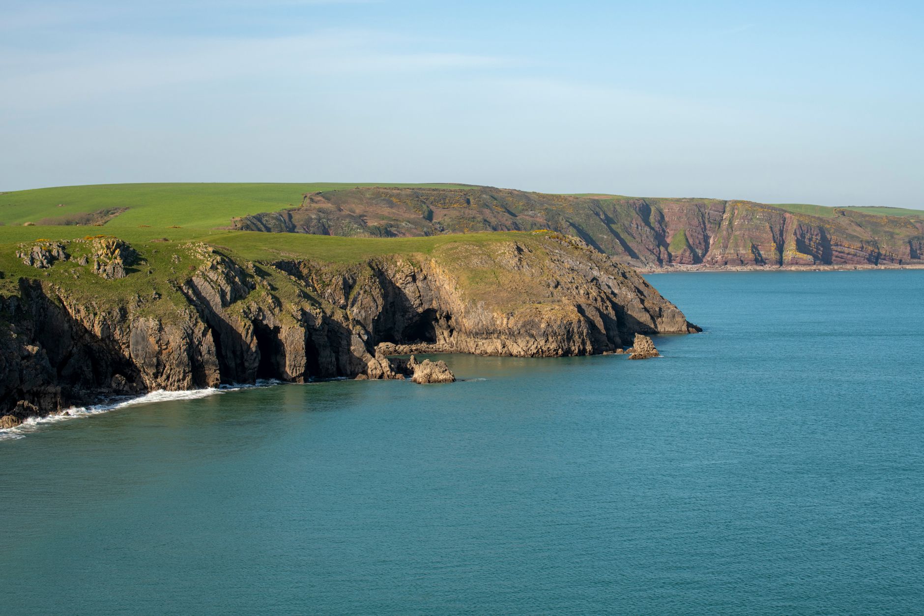 A Welsh rock once dismissed as natural is reclassified as the UK’s oldest cave art
