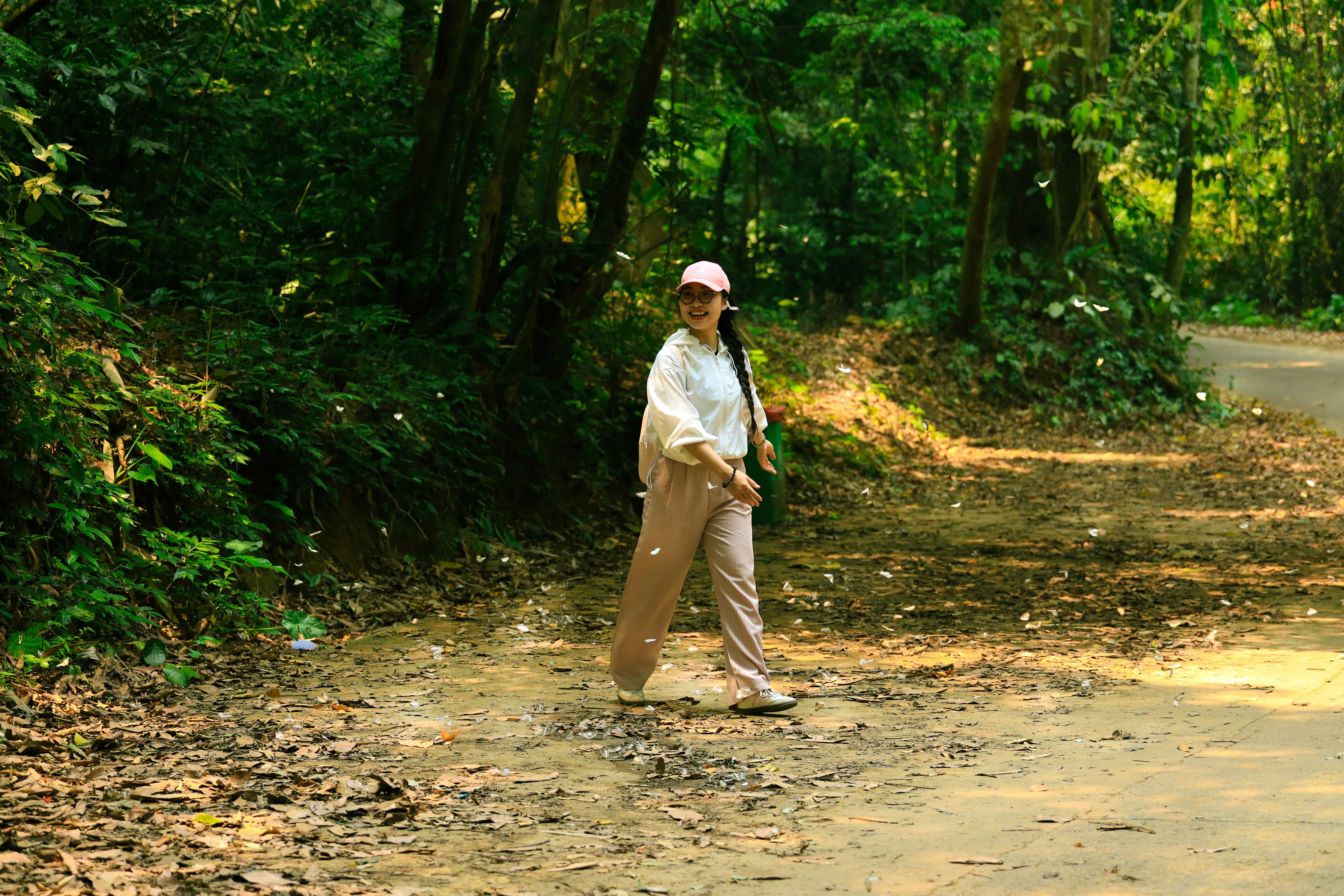 Woman Walking in Lush Forest Path in Ninh Bình · Free Stock Photo