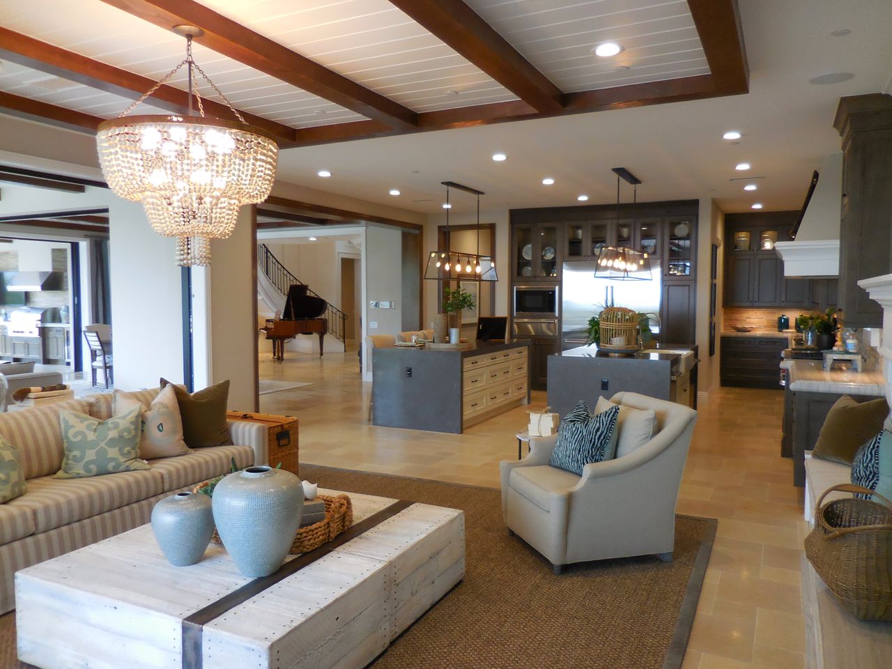 spacious living room with elegant decor and an open kitchen area featu