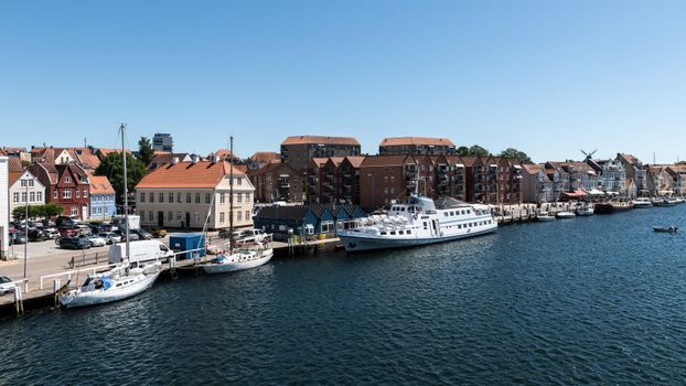 Picturesque view of boats docked at the harbour in charming Sonderborg, Denmark.