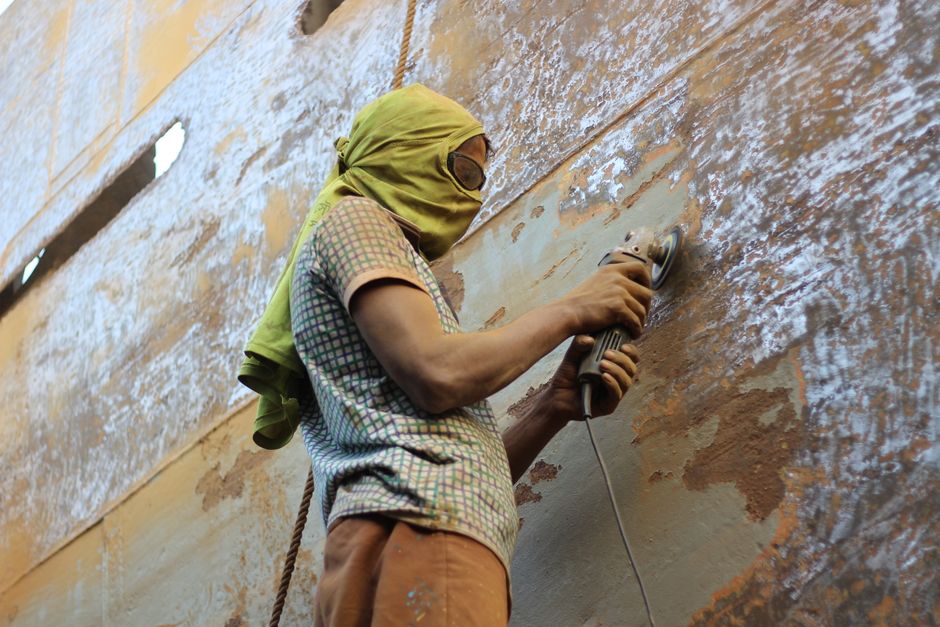 professional preparing a metal surface by sanding and cleaning - metal spray painting professional preparing a metal surface by sanding and cleaning - metal spray painting