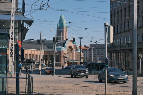 Free Busy street scene at Helsinki Central Railway Station, Finland, showcasing urban life. Stock Photo