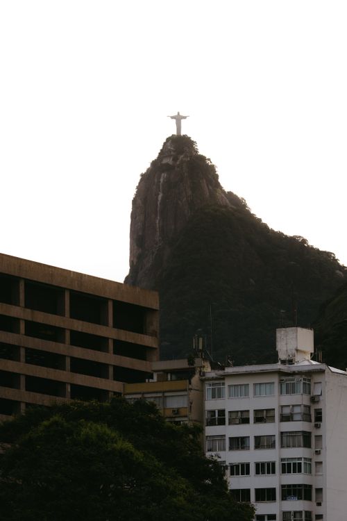 Free View of Christ the Redeemer atop Corcovado with urban Rio de Janeiro foreground. Stock Photo